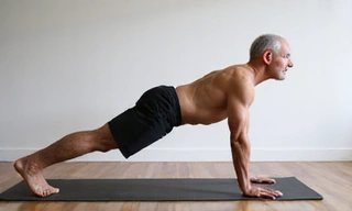 Man doing plank exercise, representing core and back muscles